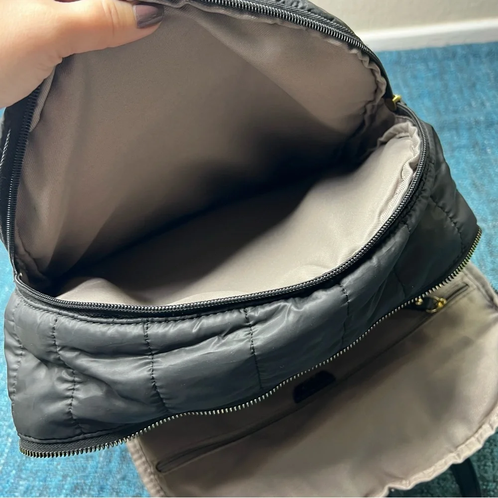 Tutilo Travel Backpack in Black with Gold Quilted Luggage Trolley Sleeve Pocket